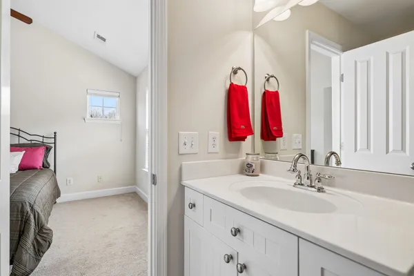 a view of walk in closet with clothes