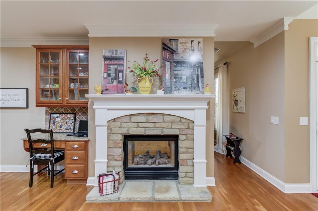 901 Providence Lane Monroe, GA 30656 - Photo 22 of 76 a living room with furniture and a fireplace