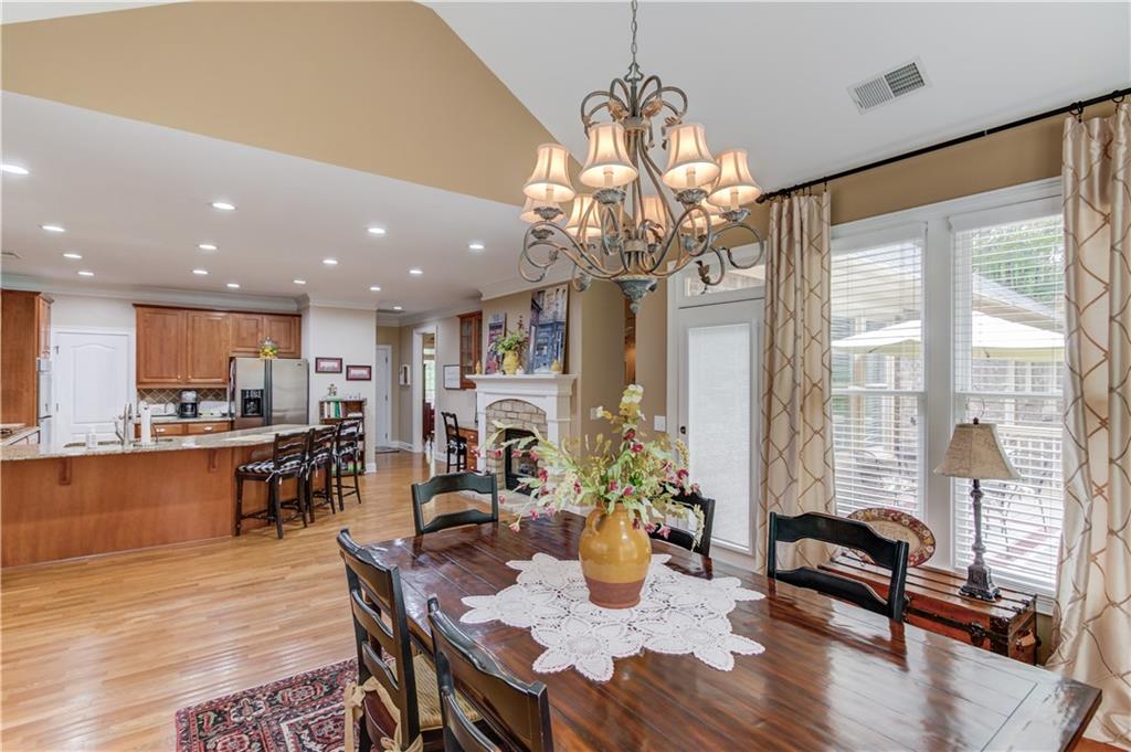 901 Providence Lane Monroe, GA 30656 - Photo 24 of 76 a view of a dining room with furniture window and wooden floor