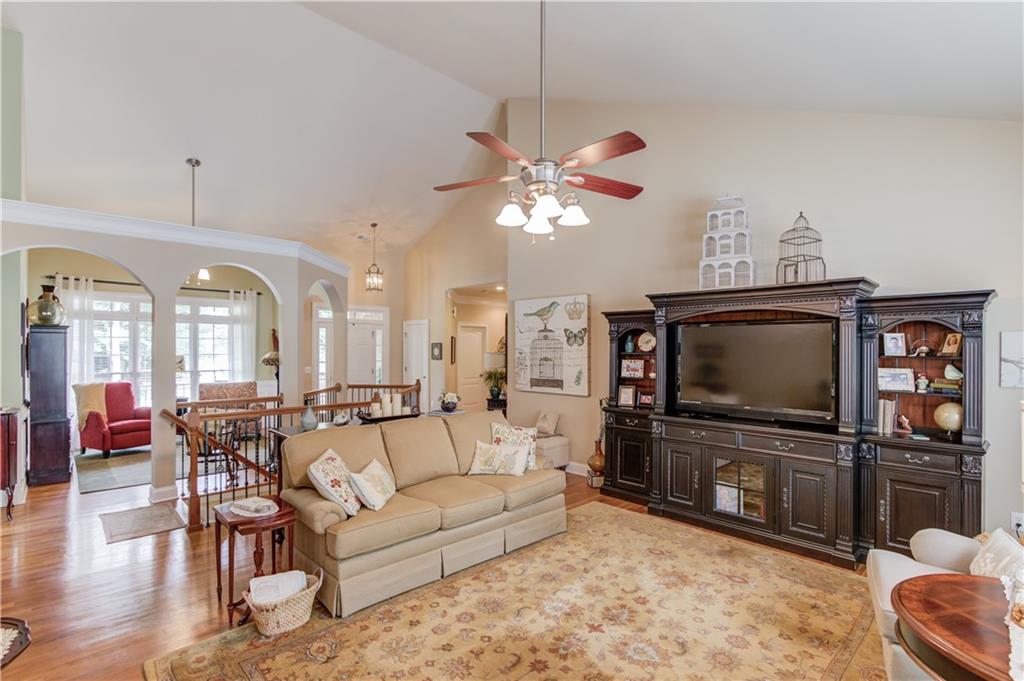 901 Providence Lane Monroe, GA 30656 - Photo 3 of 76 a living room with furniture a dining table and a fireplace