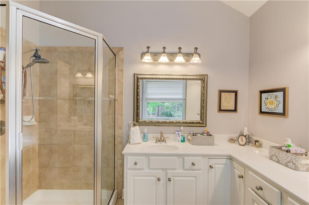 901 Providence Lane Monroe, GA 30656 - Photo 31 of 76 a bathroom with a double vanity sink mirror and double