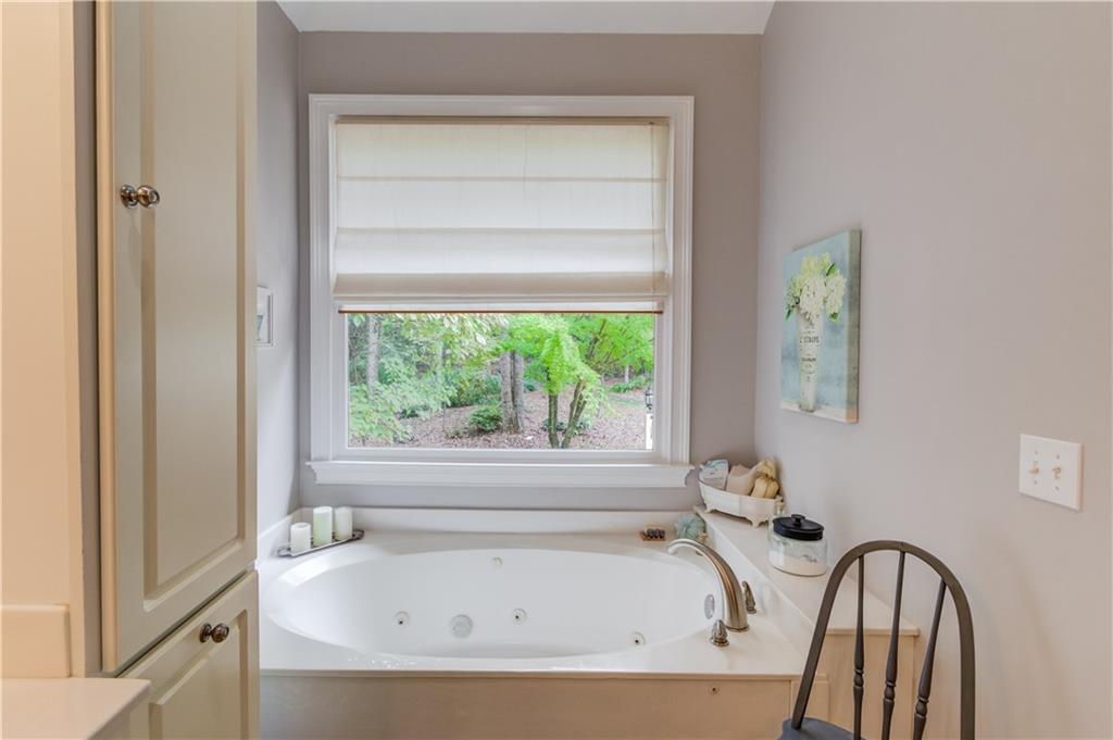 901 Providence Lane Monroe, GA 30656 - Photo 32 of 76 a bathroom with bathtub and window