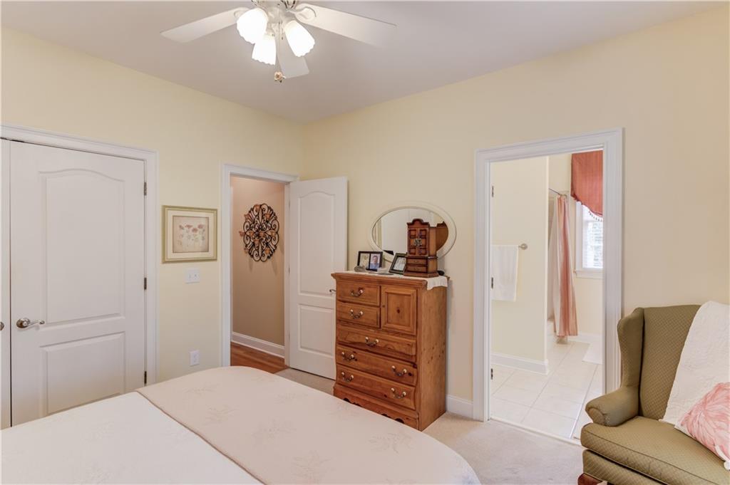901 Providence Lane Monroe, GA 30656 - Photo 35 of 76 a bedroom with a bed and furniture