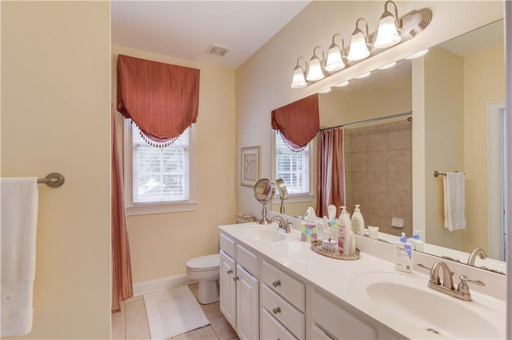 901 Providence Lane Monroe, GA 30656 - Photo 36 of 76 a bathroom with a double vanity sink mirror and toilet