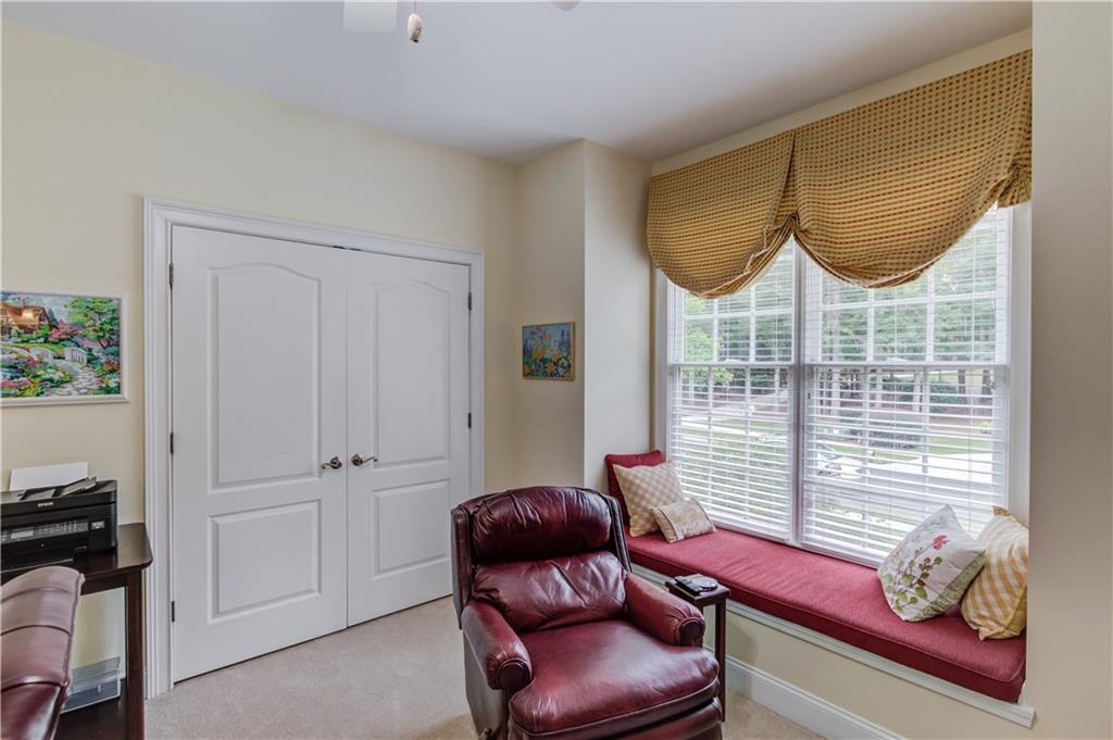 901 Providence Lane Monroe, GA 30656 - Photo 38 of 76 a room with furniture and a window