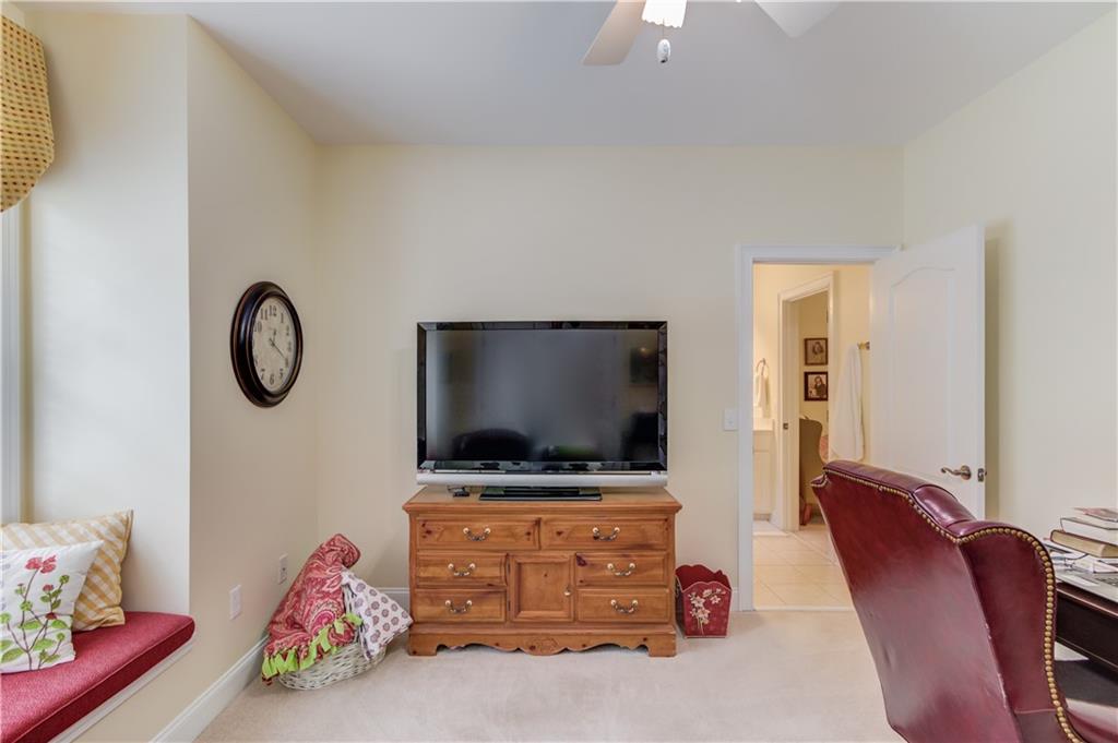 901 Providence Lane Monroe, GA 30656 - Photo 39 of 76 a living room with furniture and a flat screen tv