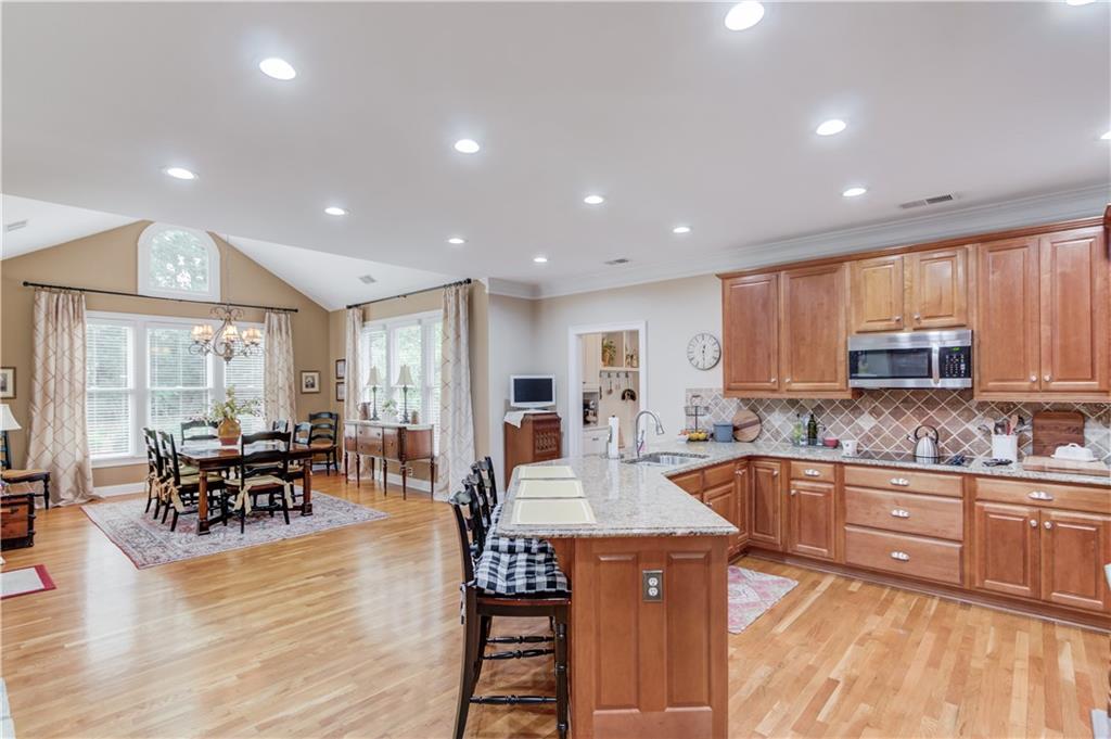 901 Providence Lane Monroe, GA 30656 - Photo 4 of 76 a kitchen with lots of counter top space and dining table