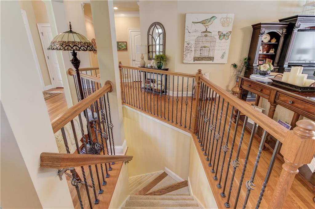901 Providence Lane Monroe, GA 30656 - Photo 41 of 76 a view of staircase with wooden floor and a window