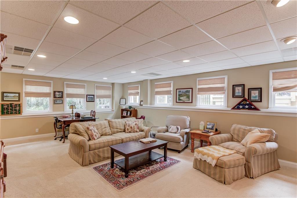 901 Providence Lane Monroe, GA 30656 - Photo 43 of 76 a living room with furniture and a large window