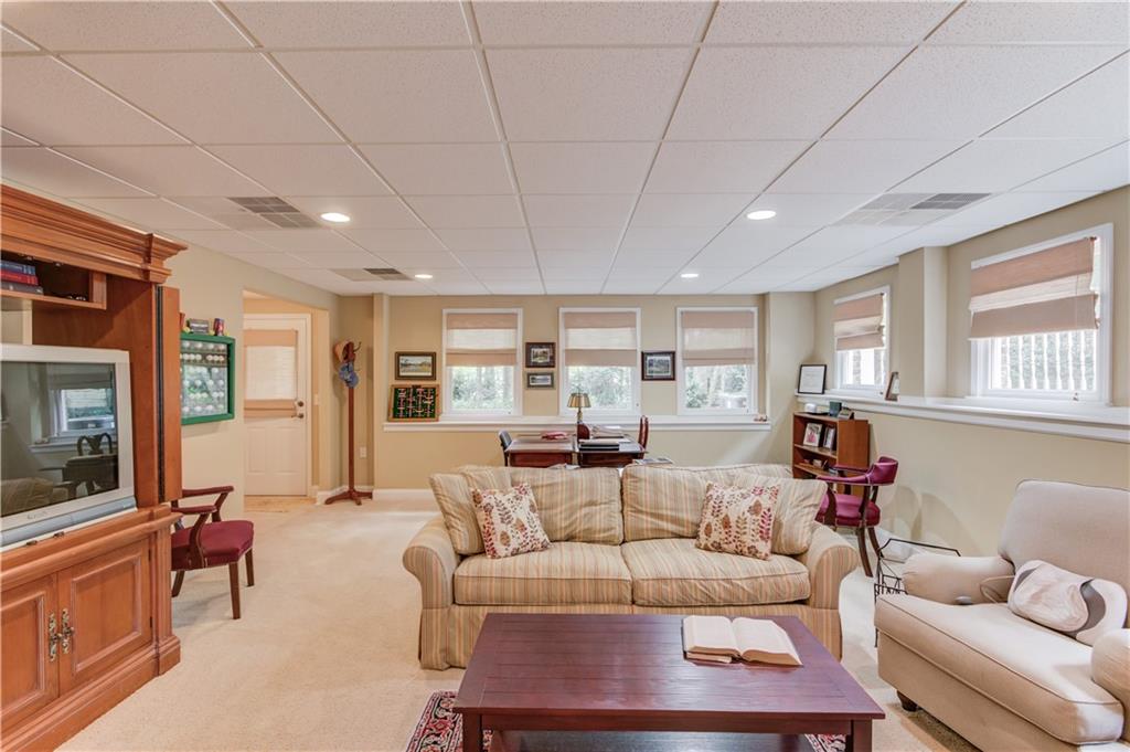 901 Providence Lane Monroe, GA 30656 - Photo 44 of 76 a living room with furniture and a flat screen tv