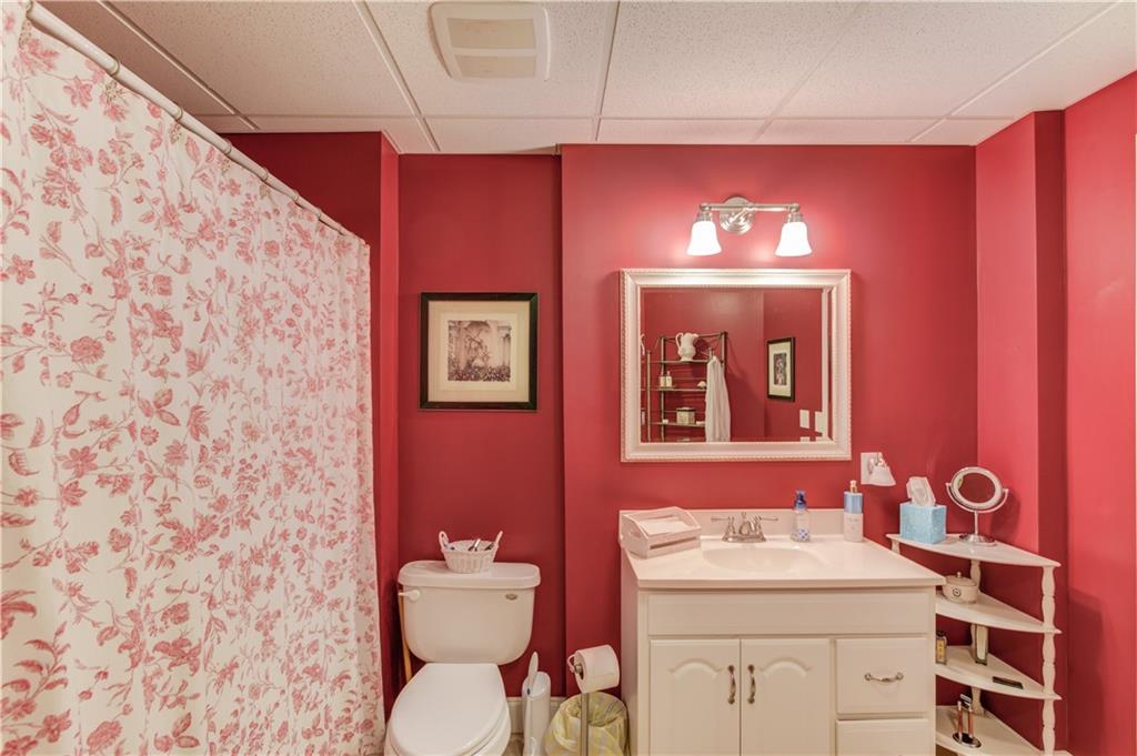 901 Providence Lane Monroe, GA 30656 - Photo 50 of 76 a bathroom with a sink and a mirror
