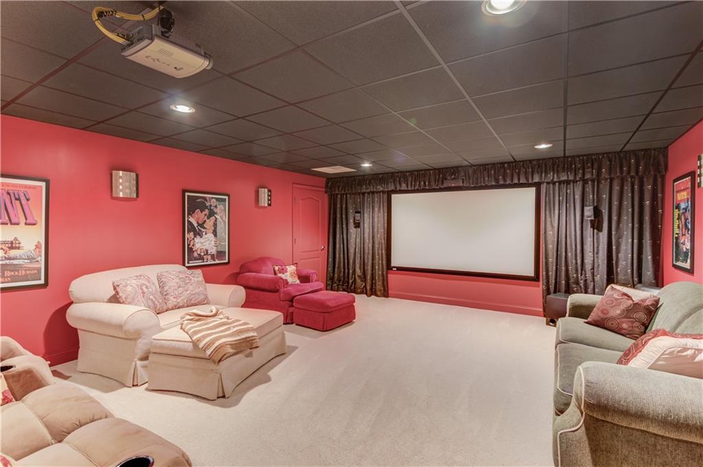 901 Providence Lane Monroe, GA 30656 - Photo 5 of 76 a projector room with couch