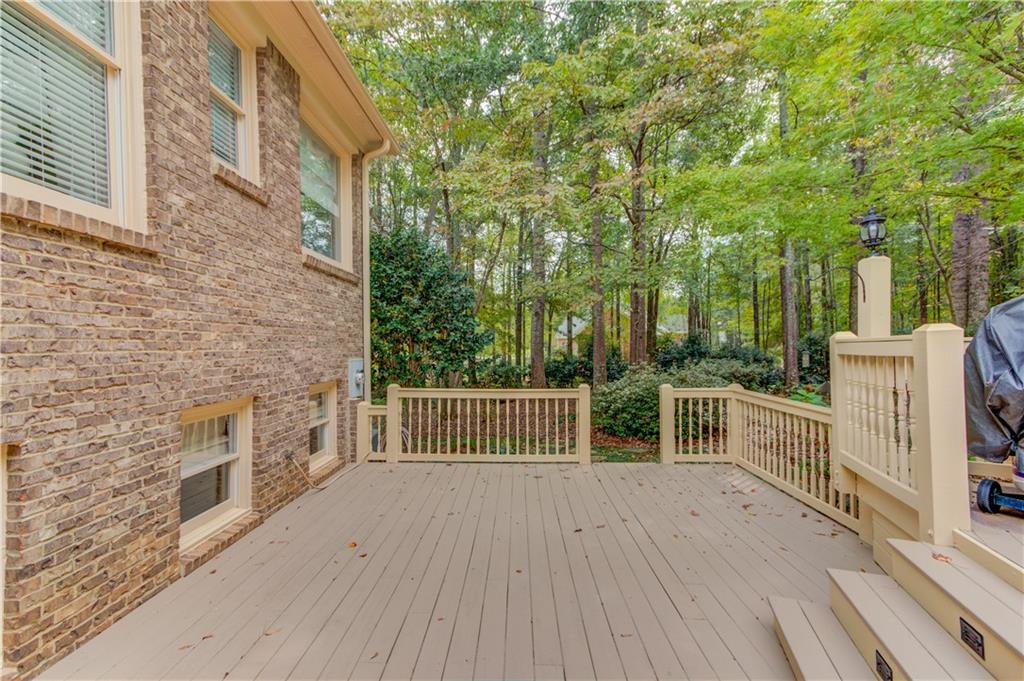 901 Providence Lane Monroe, GA 30656 - Photo 55 of 76 a balcony with wooden floor and fence