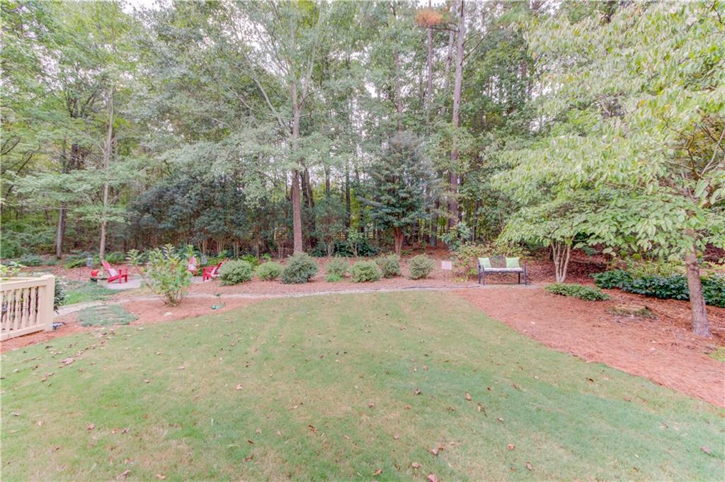 901 Providence Lane Monroe, GA 30656 - Photo 58 of 76 a view of swimming pool with sitting area and covered with green space