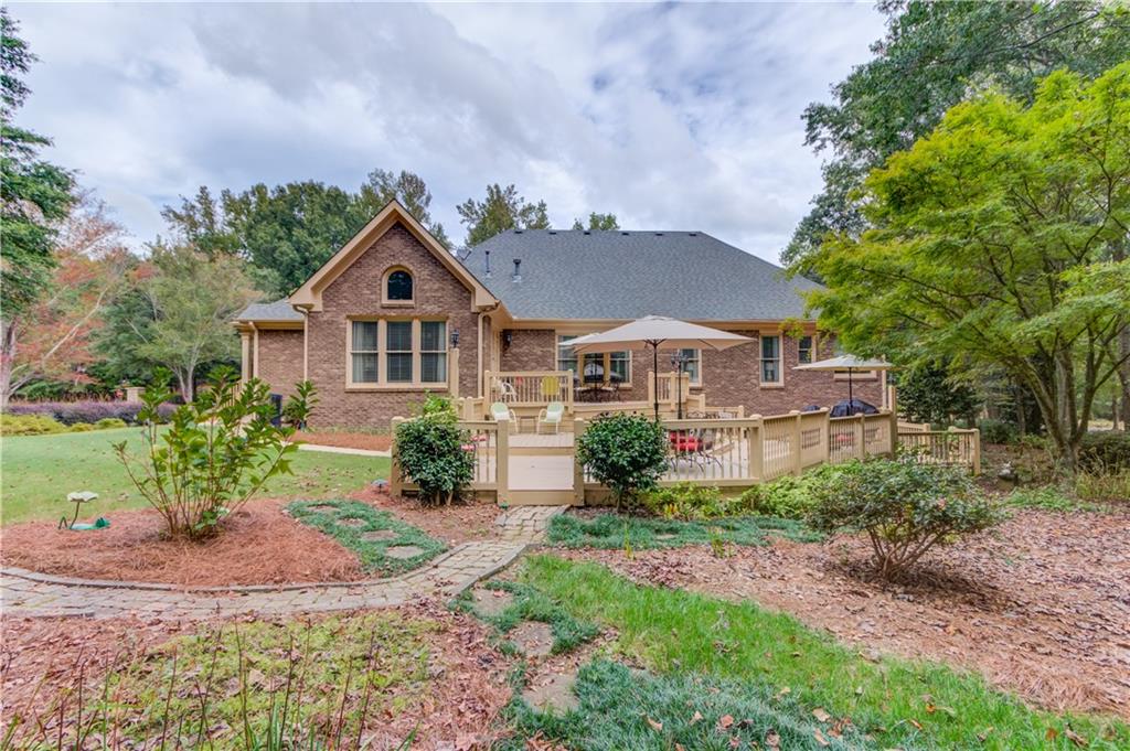 901 Providence Lane Monroe, GA 30656 - Photo 62 of 76 a front view of a house with a yard and garage