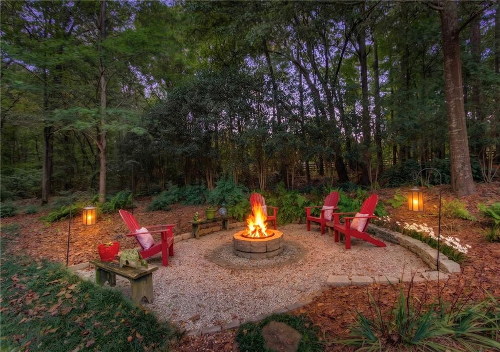 901 Providence Lane Monroe, GA 30656 - Photo 7 of 76 a backyard of a house with yard table and chairs