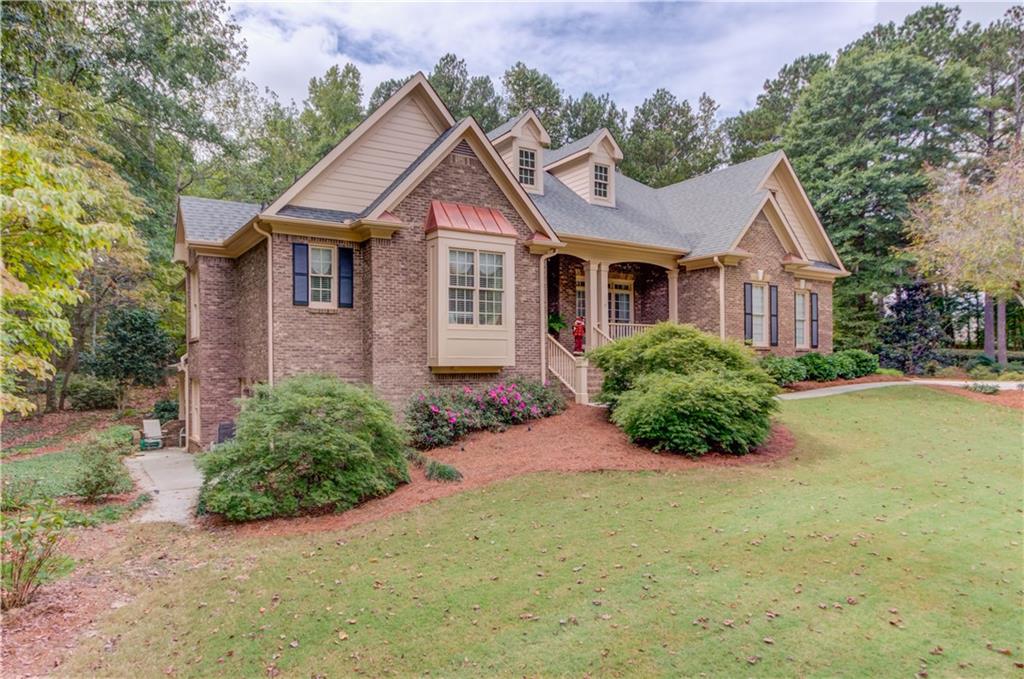 901 Providence Lane Monroe, GA 30656 - Photo 9 of 76 a front view of a house with yard and green space
