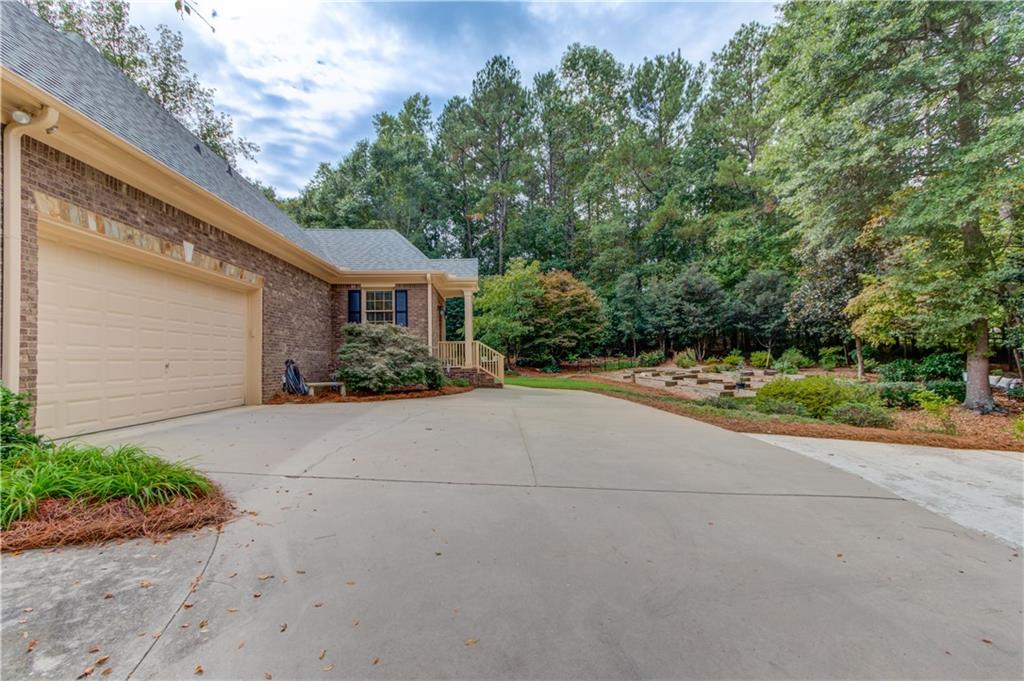901 Providence Lane Monroe, GA 30656 - Photo 10 of 76 a front view of a house with garden