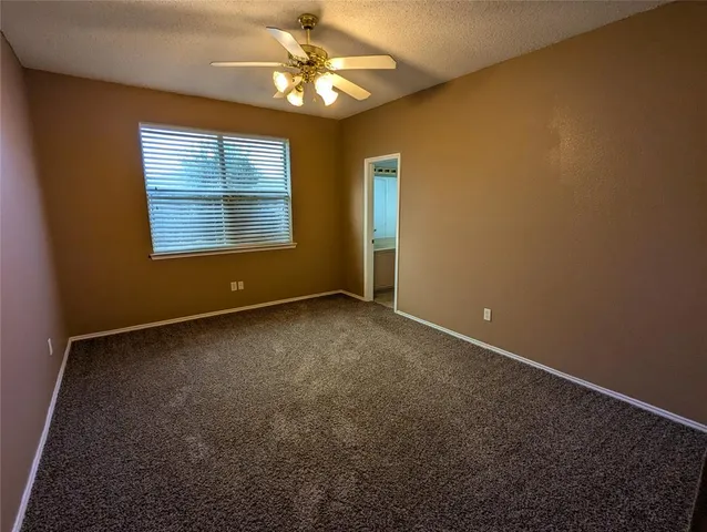 an empty room with a empty space and windows