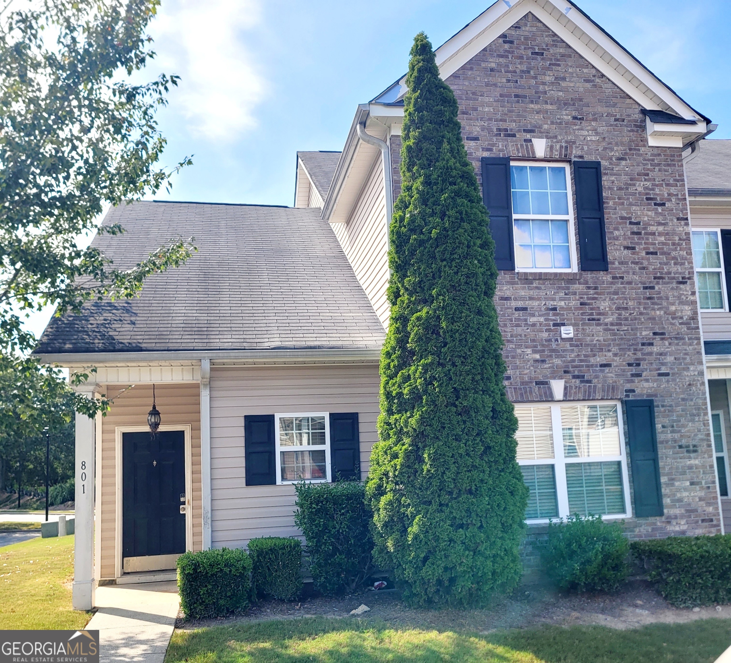 2555 Flat Shoals Road, Unit 801 South Fulton, GA 30349 - Photo 1 of 25 front view of a house with a yard