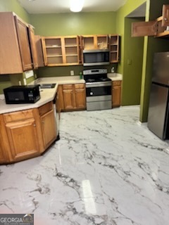 2555 Flat Shoals Road, Unit 801 South Fulton, GA 30349 - Photo 3 of 25 a kitchen with stainless steel appliances a stove and a refrigerator