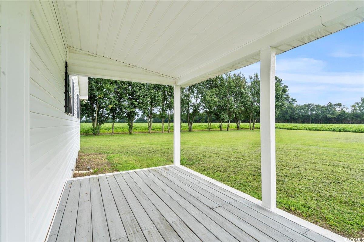 148 High Hill Road Lake View, SC 29563 - Photo 12 of 40 Wooden terrace with a lawn and view of wooded area