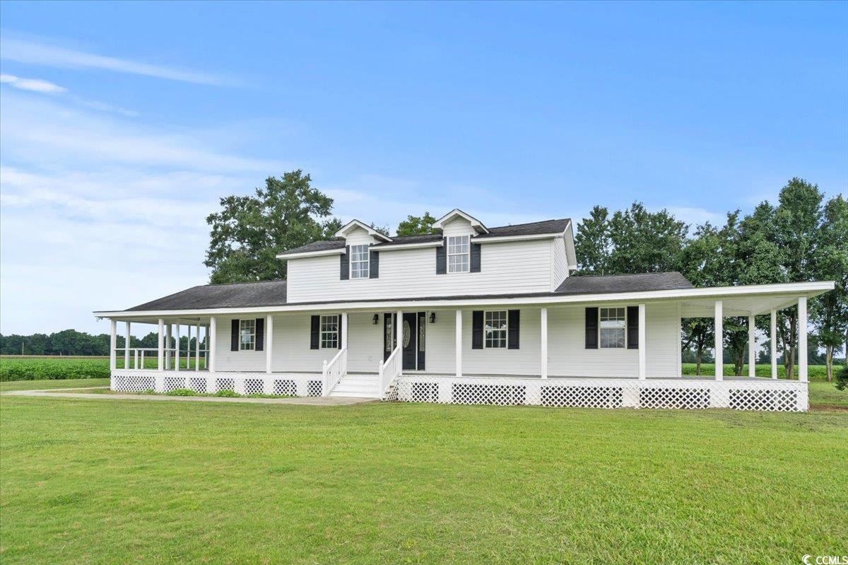 148 High Hill Road Lake View, SC 29563 - Photo 3 of 40 Farmhouse inspired home featuring a large porch and a front lawn