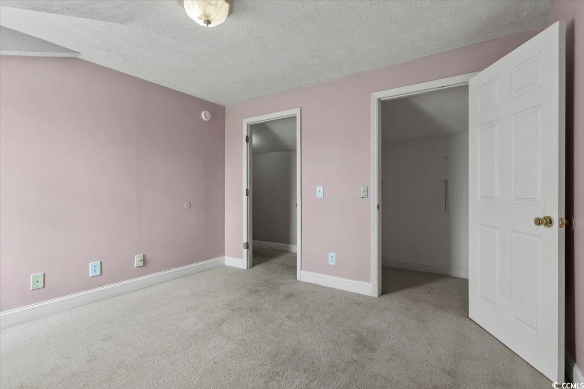 148 High Hill Road Lake View, SC 29563 - Photo 36 of 40 Unfurnished bedroom featuring a textured ceiling and light colored carpet