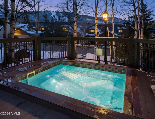 a view of a backyard with wooden floor