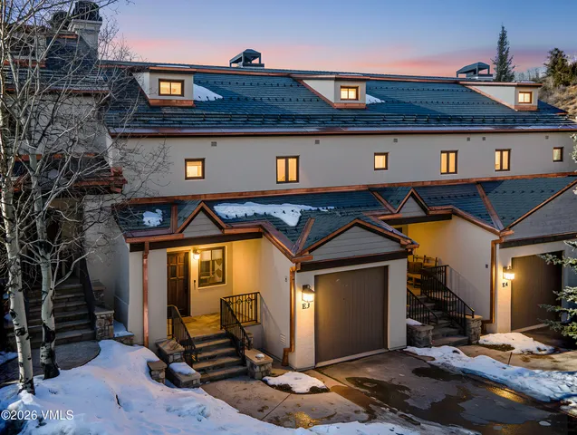 a front view of a house with a garage