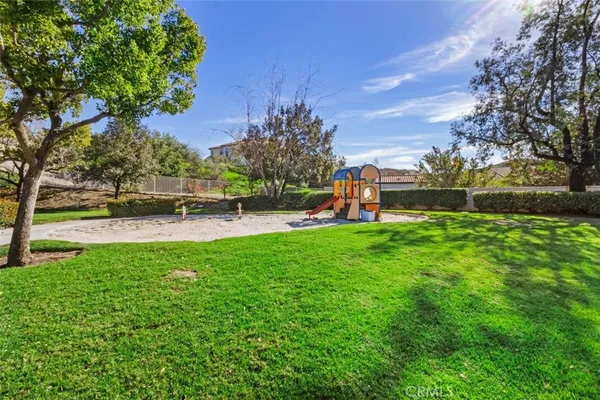 a view of a park with houses