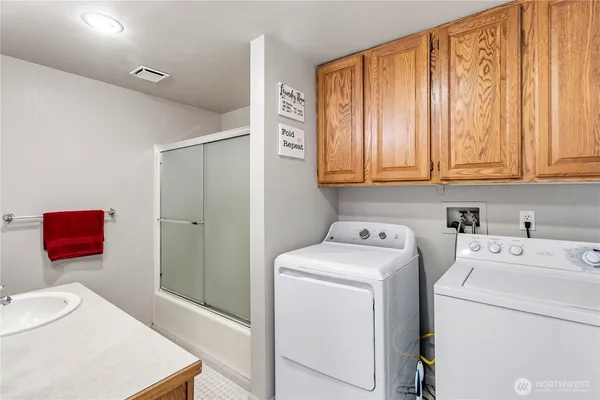 a utility room with dryer and washer