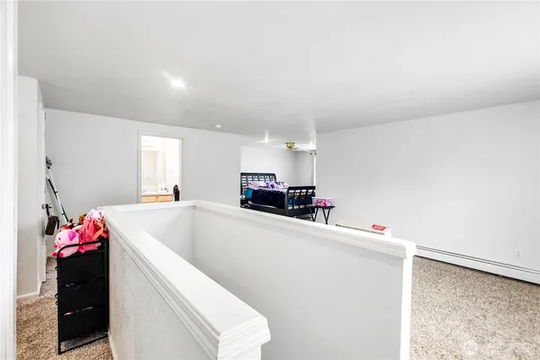 a utility room with cabinets washer and dryer
