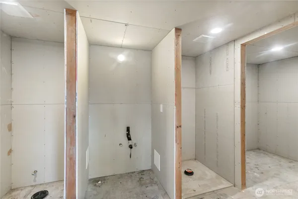 a bathroom with a glass shower door