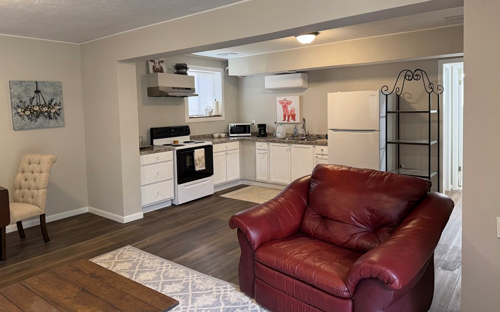 3121 Bellanca Street Columbus, GA 31909 - Photo 11 of 35 a living room with stainless steel appliances furniture a refrigerator and a kitchen