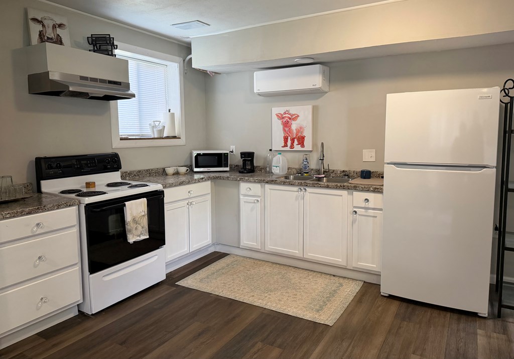 3121 Bellanca Street Columbus, GA 31909 - Photo 13 of 35 a kitchen with a sink a stove and a refrigerator