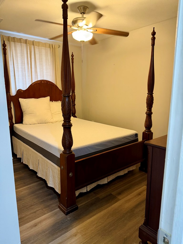 3121 Bellanca Street Columbus, GA 31909 - Photo 15 of 35 a bed sitting in a bedroom next to a window