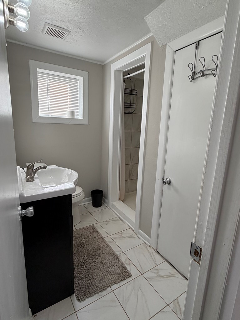 3121 Bellanca Street Columbus, GA 31909 - Photo 18 of 35 a bathroom with a sink and mirror