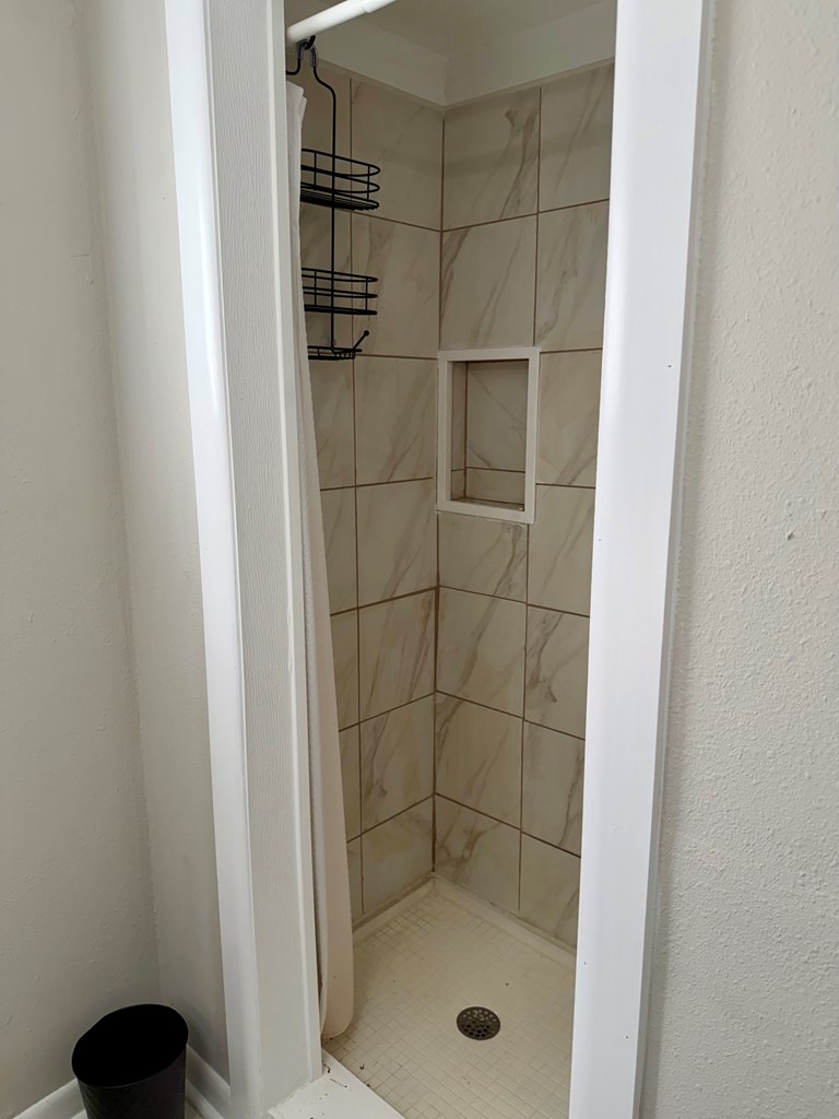 3121 Bellanca Street Columbus, GA 31909 - Photo 19 of 35 a bathroom with a glass shower door
