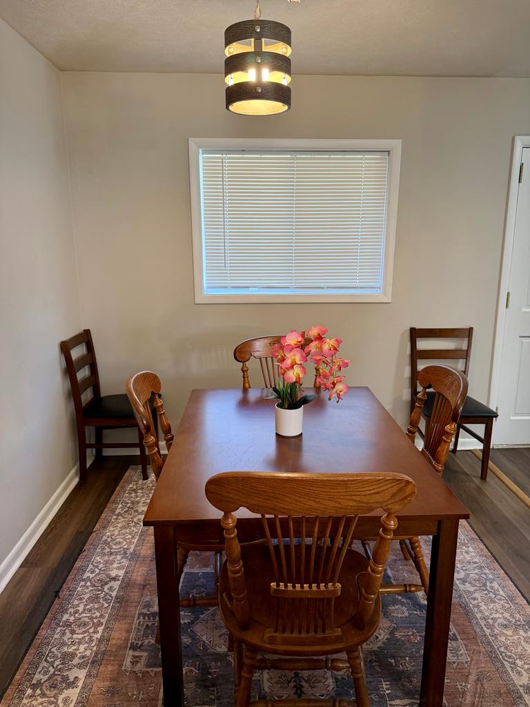 3121 Bellanca Street Columbus, GA 31909 - Photo 25 of 35 a view of a dining room with furniture and wooden floor