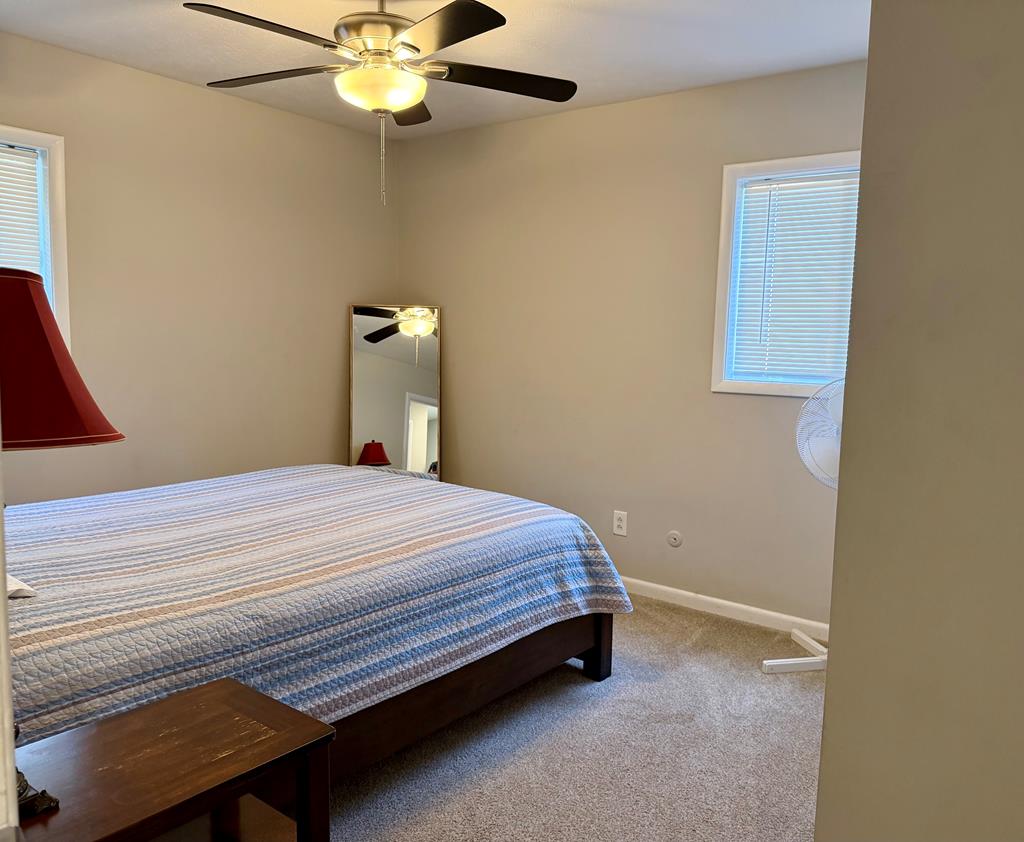 3121 Bellanca Street Columbus, GA 31909 - Photo 31 of 35 a bedroom with a bed and a chandelier