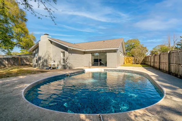 a view of a swimming pool with a lounge chairs