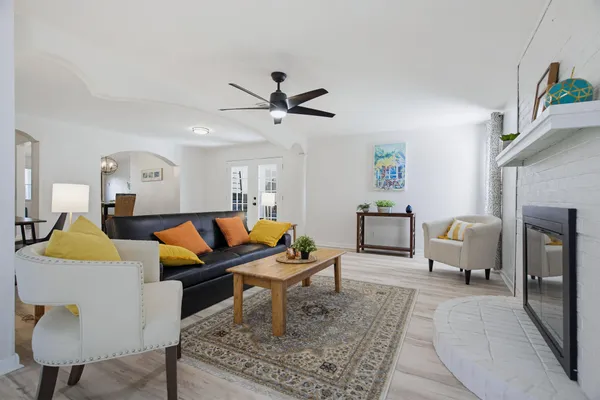 a living room with furniture and a fireplace