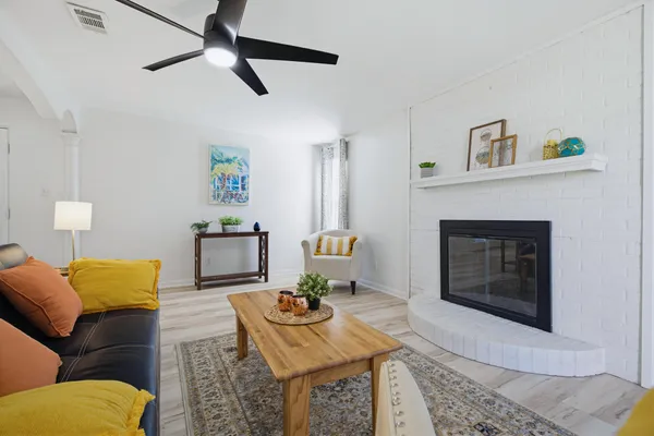 a living room with furniture and a fireplace