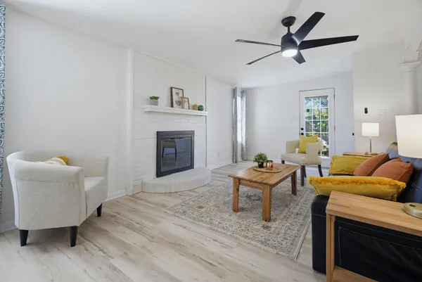 a living room with furniture and a fireplace