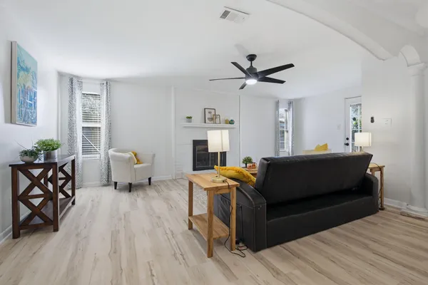 a living room with furniture and a large window