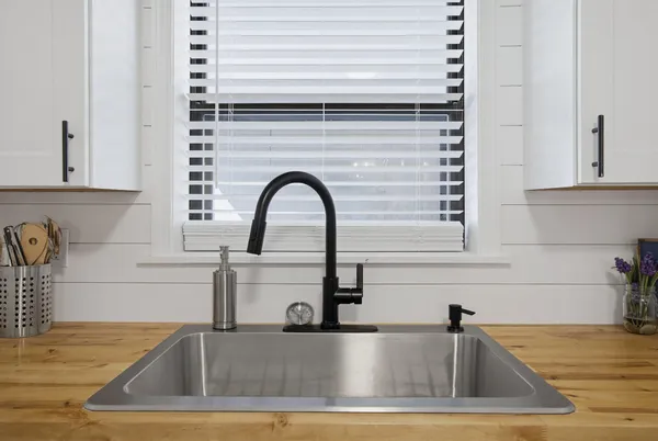 a kitchen with a sink and a window