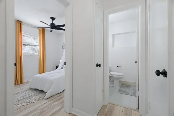 a bedroom with a bed and a view of bathroom
