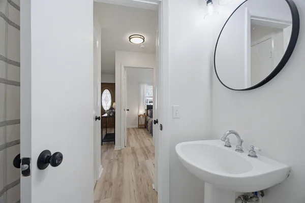 a bathroom with a sink and a mirror
