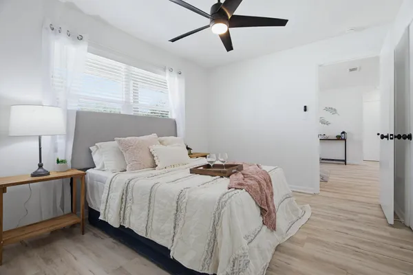 a bedroom with a bed and cabinets